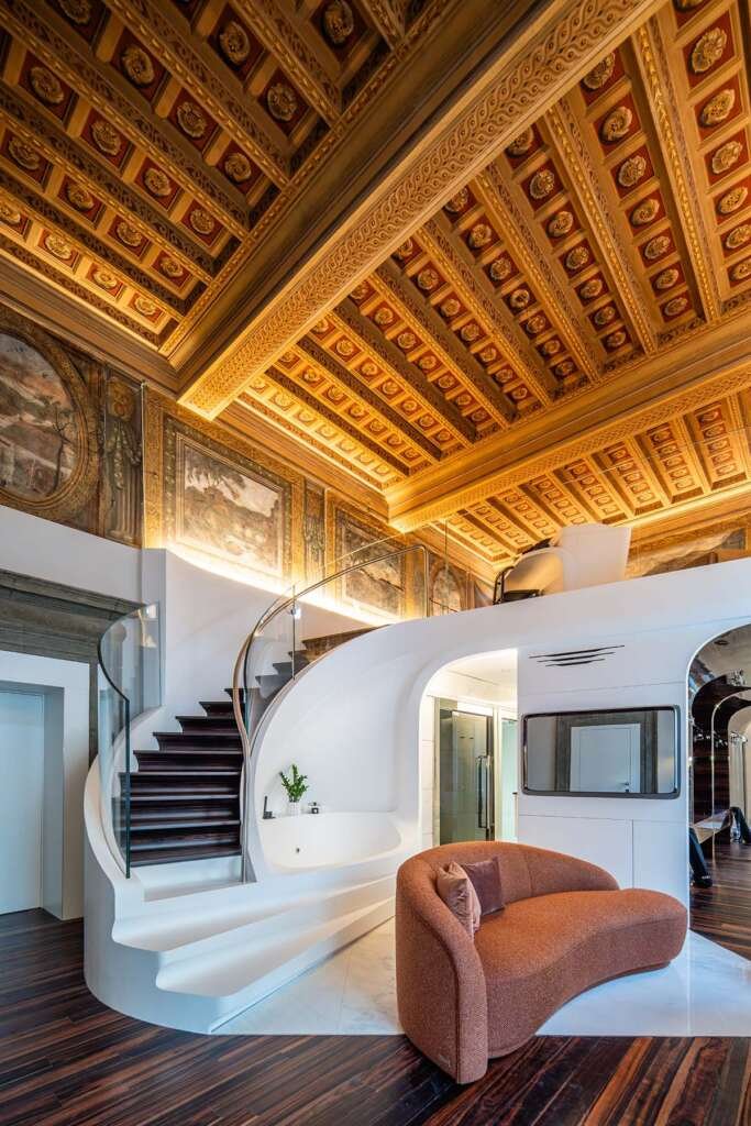 Sculptural interior of Hotel Romeo Roma with flowing ebony curves designed by Zaha Hadid Architects