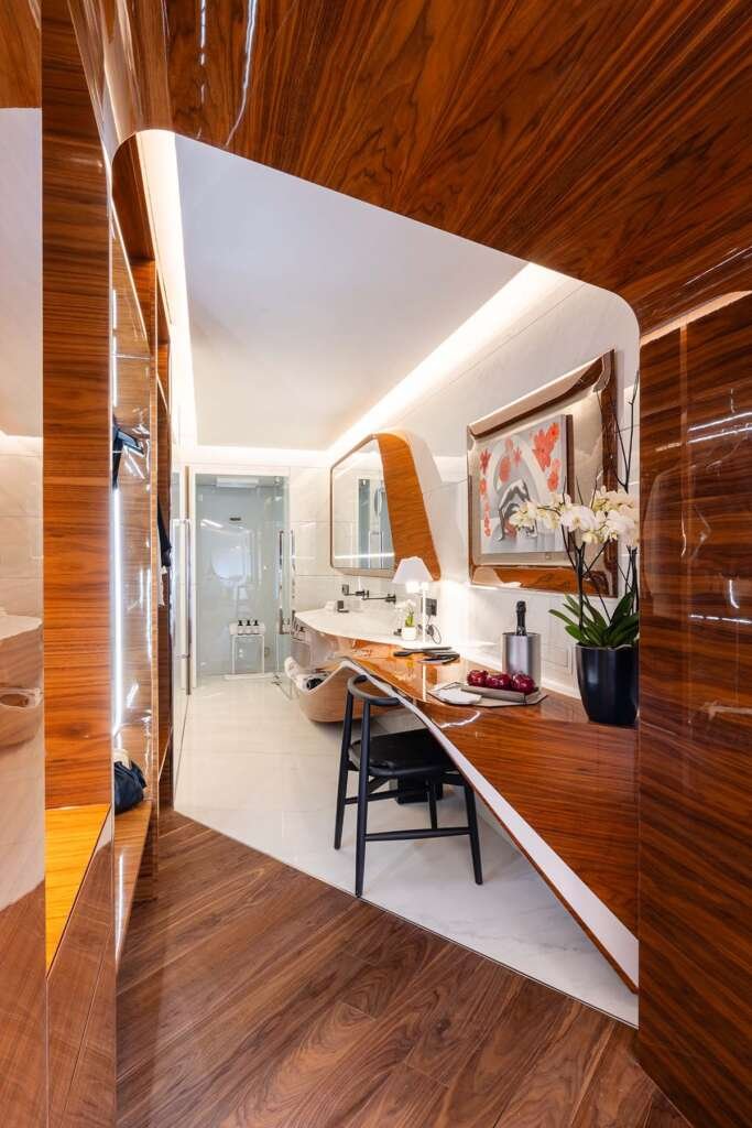 Sculptural interior of the rooms at the Hotel Romeo Roma with flowing ebony curves designed by Zaha Hadid Architects