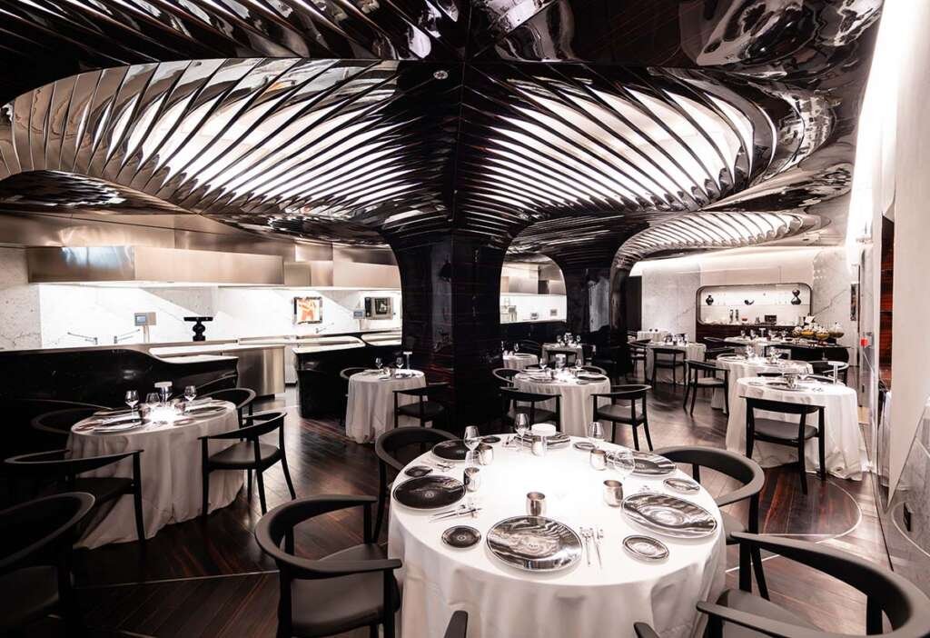 Luxurious dining space of Il Ristorante Alain Ducasse inside Hotel Romeo Roma designed by Zaha Hadid Architects