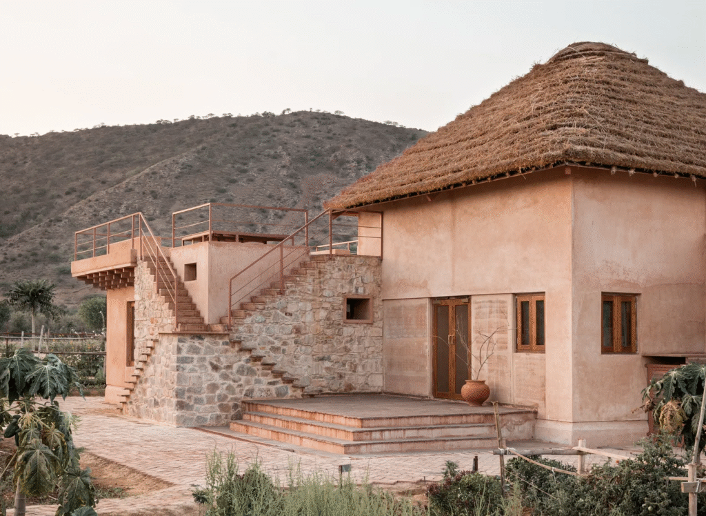 Rammed earth walls made using on-site soil, lime, and fenugreek seeds - Mud House by Sketch Design Studio