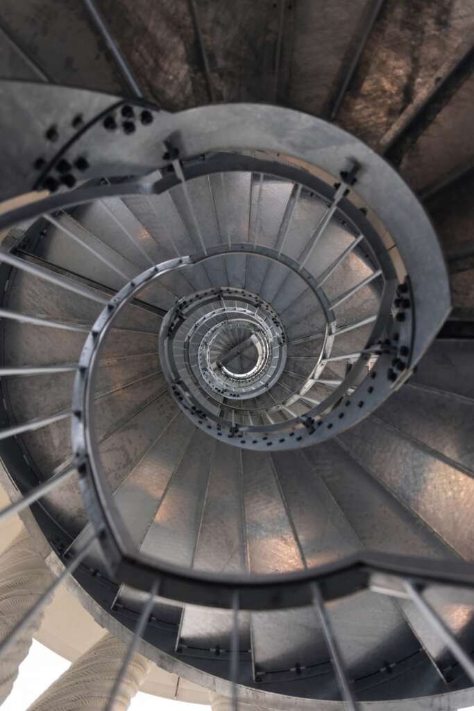 Interior of Tor Alva featuring a sculptural spiral staircase connecting the four storeys of the 3D-printed tower