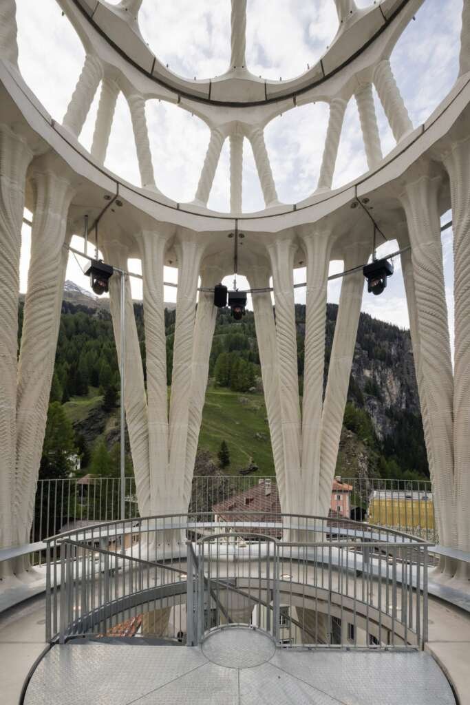 Close-up view of prefabricated 3D-printed concrete columns with intricate relief patterns used in Tor Alva