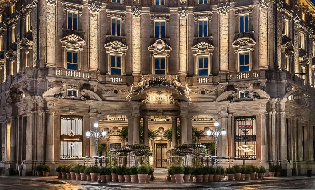 Starbucks Milan with marble counters, olive wood panels, and floor-to-ceiling windows