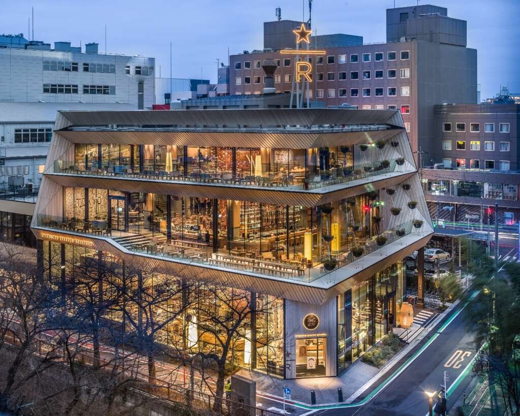 Starbucks Nakameguro Tokyo with glass walls, wooden interiors, and river view