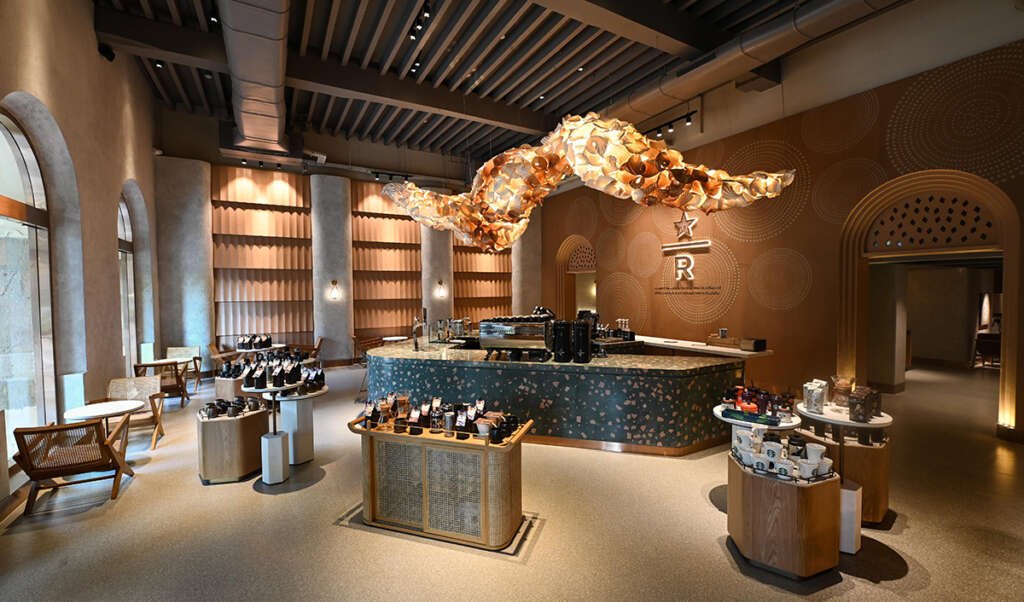Starbucks Reserve Mumbai with brass accents, wood panels, and minimalist design