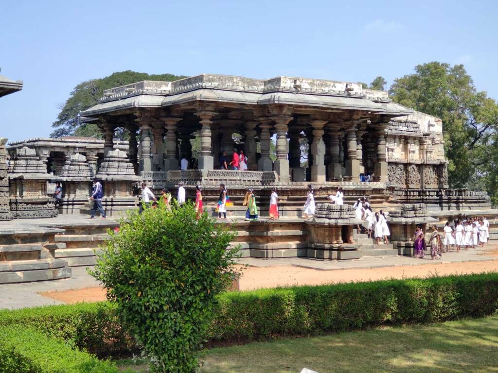 Hoysaleswara Temple at Halebidu is a prime example of a multi-towered temple, with its central structure surrounded by smaller towers, each adorned with intricate carvings.