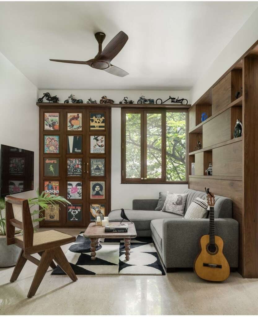 Living room with wooden shelves repurposed as display cabinet for old records