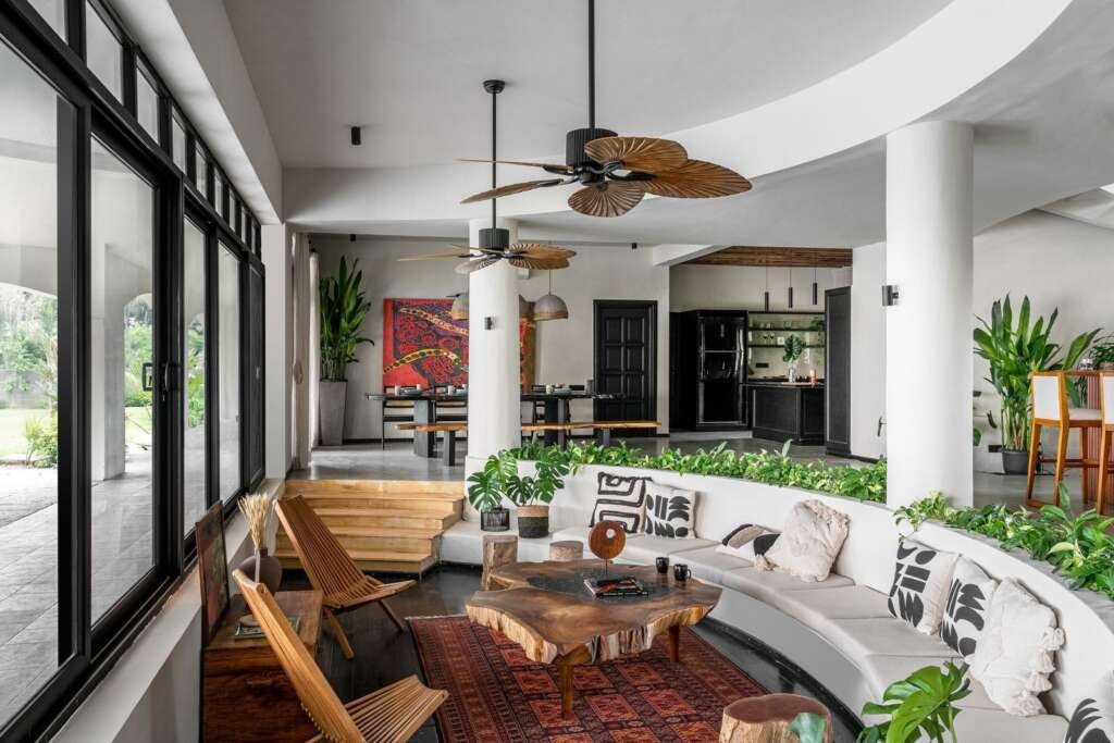 Sunken living room with curved seating in a holiday home
