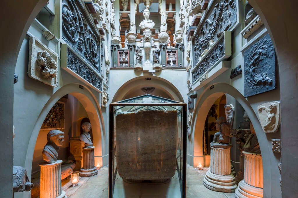 interior of Sir John Soane's Museum filled with artefacts and sculptures