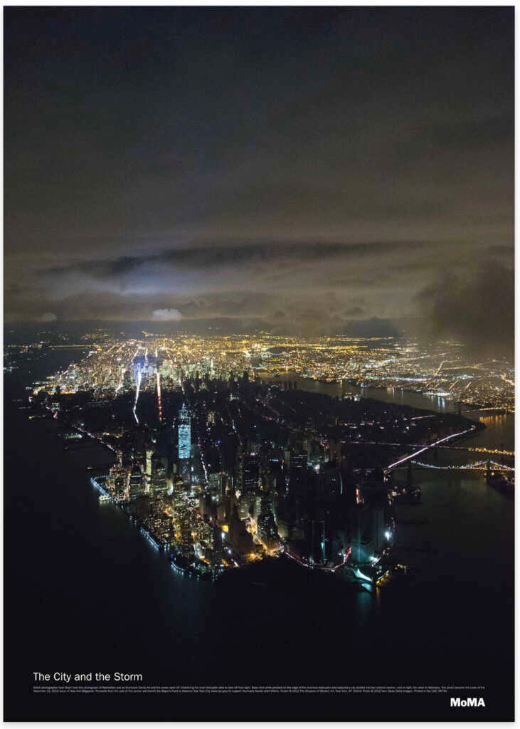 Aerial view of a cityscape at night where one half is entirely lit and the other is dark