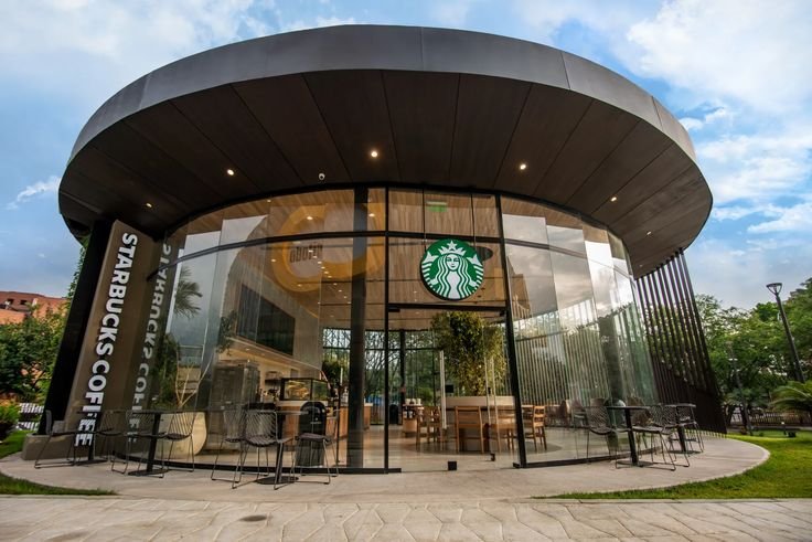 Starbucks Cali Colombia with curved roof, colorful interiors, and artisan furniture