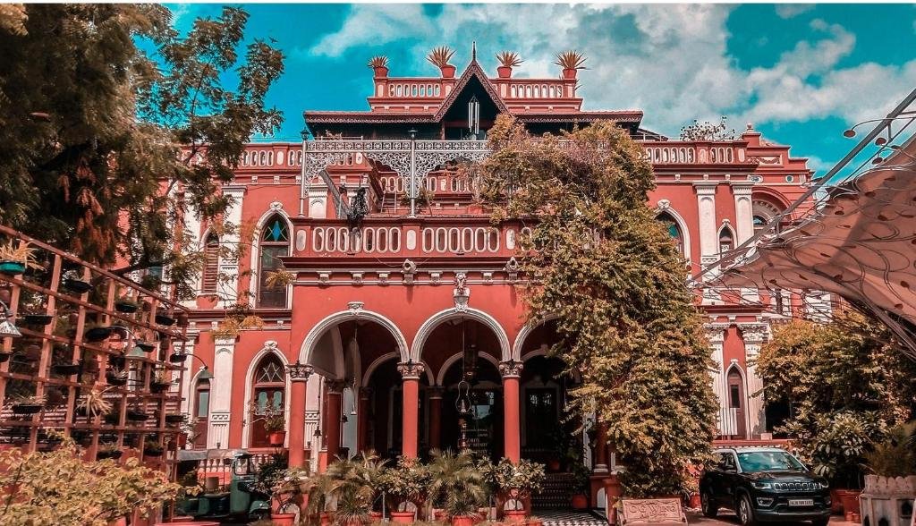 The House of MG in Ahmedabad, showcasing a fusion of colonial and Gujarati architectural styles with antique furniture and wooden balconies