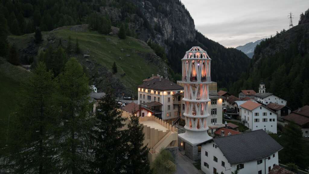 World’s Tallest 3D-Printed Tower Rises In Tiny Swiss Village 1 photograph of tor alva nestled in the mountainous landscape of mulegns, switzerland
