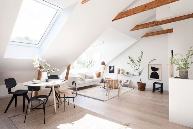 Maximizing natural light in a small living room with expansive windows.