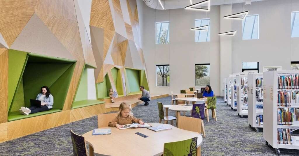 What Makes A Public Library Great? Design Lessons From Famous Libraries 2 modern library interior featuring open public spaces, collaborative seating, and extensive natural daylight.